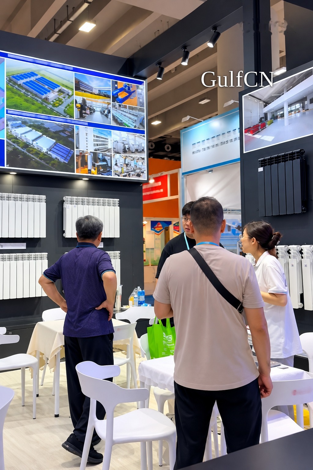 GulfCN reviewing radiator range with a supplier at a China trade fair