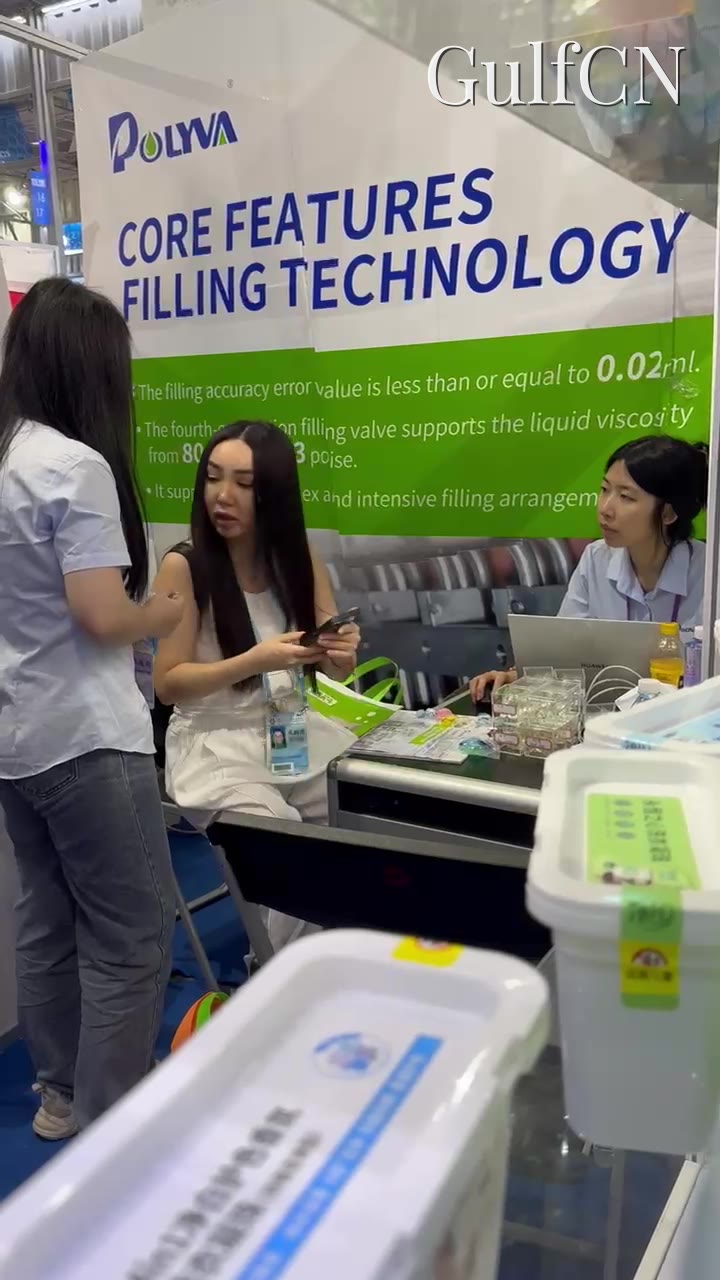 China trade-fair stand, team checking multi-chamber pod samples for a Dubai manufacturer